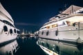 Luxury yachts in La Spezia harbor at night with reflection in wa Royalty Free Stock Photo