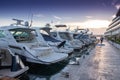 Luxury yachts moored in the marina.