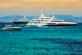 Luxury yachts in turquoise beach of Formentera Illetes Royalty Free Stock Photo