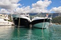 Luxury yacts moored at marina. Beautiful scenic bay. Bright sunny day with blue sky and mountains on the background. Boat trips an Royalty Free Stock Photo