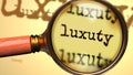 Luxuty and a magnifying glass on English word Luxuty to symbolize studying, examining or searching for an explanation and answers Royalty Free Stock Photo