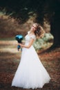 Luxuty portrait of blonde bride with bridal bouquet in autumn Royalty Free Stock Photo