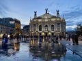 Lviv Opera House building and Musical Fountains in front of it in the evening in Ukraine