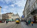 Lviv, Ukraine - APRIL18, 2023: People on streets of Lviv. Citizens and tourists walk and rest on Market Square in Lviv Royalty Free Stock Photo