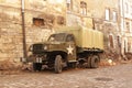 Lviv, Ukraine - 9 9 2019: Army american cars on a street destroyed by war. Scenery for the Holocaust feature film during