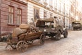 Lviv, Ukraine - 9 9 2019: Army american cars on a street destroyed by war. Scenery for the Holocaust feature film during World War