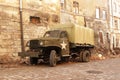 Lviv, Ukraine - 9 9 2019: Army american cars on a street destroyed by war. Scenery for the Holocaust feature film during World War