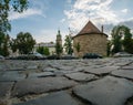 Cobblestone street of Vladimir Vinnichenko and the Powder Tower of the 16th century