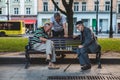 Lviv, Ukraine - August 3, 2019 - seniors playing chess at city bench park Royalty Free Stock Photo