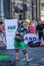 LVIV, UKRAINE - AUGUST 2015: Strong athlete athlete raises heavy weight on Strongmen games