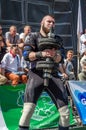 LVIV, UKRAINE - AUGUST 2015: Strong athlete athlete raises heavy weight on Strongmen games