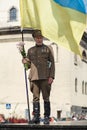 Lviv, UKRAINE - August 24, 2017: A veteran of the Ukrainian Insurgent Army holds a flag of Ukraine