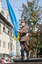 Lviv, UKRAINE - August 24, 2017: A veteran of the Ukrainian Insurgent Army holds a flag of Ukraine