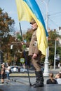 Lviv, UKRAINE - August 24, 2017: A veteran of the Ukrainian Insurgent Army holds a flag of Ukraine