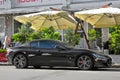 Lviv - Ukraine. Autumn. September, 2017. Beautiful black supercar near the cafe. Private car parked in the parking lot