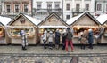 Christmas market in Lviv. Sweets trays and tourists buying presents at the Christmas market Royalty Free Stock Photo