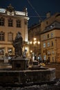 Lviv, Ukraine - December 8, 2021: FOUNTAIN WITH A SCULPTURE FIGURE OF DIANA. Sculpture Covered In Snow