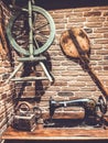 Lviv, Ukraine - December 25, 2018: Old loom, sewing machine. Accessories for sewing. Ancient things on the table