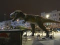 Realistic dinosaur sculpture in front of a shopping center in the center of Lviv