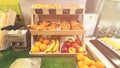 LVIV, UKRAINE - December 6, 2019: On the wooden shelves various fruits, rolls, croissants, cookies.