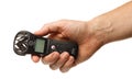 LVIV, UKRAINE - December 15, 2020: ZOOM H1n sound recorder in hand isolate