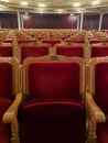 LVIV, UKRAINE - February 22, 2020: Lviv Opera and Ballet Theatre interior. Row of red chairs in the theatre. Closeup mobile photo