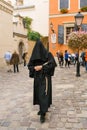 Lviv, Ukraine. Guide in monk clothes on an animated tour for tourists