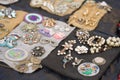 Lviv, Ukraine - January 16, 2022 : Antiques on flea market - close up view of vintage jewelry, silver brooches, vintage
