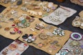 Lviv, Ukraine - January 16, 2022 : Antiques on flea market - close up view of vintage jewelry, silver brooches, vintage