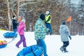 LVIV, UKRAINE - January 7, 2019: children sliding snow tube down by snowed hill