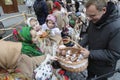 Ukrainians sing Christmas carols as they carry a huge decorated star of Bethlehem and sheaves of wheat in their hands during a