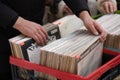 Lviv, Ukraine - January 16, 2022 : man looking for old vinyl records on flea market or thrift store. Collection of Royalty Free Stock Photo