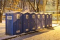 LVIV, UKRAINE - January 14, 2021: Outdoor plastic toilets at night and in winter