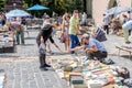 Lviv, Ukraine - July 2015: Men and women choose and buy, and sellers are selling old rare books and vintage items in the book mark Royalty Free Stock Photo