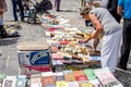 Lviv, Ukraine - July 2015: Men and women choose and buy, and sellers are selling old rare books and vintage items in the book mark Royalty Free Stock Photo