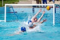 Lviv, Ukraine - July 2015: Ukrainian Cup water polo. Athlete team's water polo ball in a swimming pool and makes attacking shot on Royalty Free Stock Photo