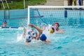 Lviv, Ukraine - July 2015: Ukrainian Cup water polo. Athlete team's water polo ball in a swimming pool and makes attacking shot on Royalty Free Stock Photo