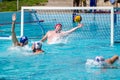 Lviv, Ukraine - July 2015: Ukrainian Cup water polo. Athlete team's water polo ball in a swimming pool and makes attacking shot on Royalty Free Stock Photo