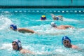 Lviv, Ukraine - July 2015: Ukrainian Cup water polo. Athlete team's water polo ball in a swimming pool and makes attacking shot on Royalty Free Stock Photo