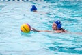 Lviv, Ukraine - July 2015: Ukrainian Cup water polo. Athlete team's water polo ball in a swimming pool and makes attacking shot on Royalty Free Stock Photo