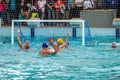Lviv, Ukraine - July 2015: Ukrainian Cup water polo. Athlete team's water polo ball in a swimming pool and makes attacking shot on Royalty Free Stock Photo