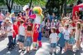 Lviv, Ukraine - July 2015: Yarych street Fest 2015. Clown and Indian play, sing and dance with the children in the park Royalty Free Stock Photo