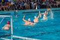 LVIV, UKRAINE - JUNE 2016: Athletes water polo players fighting for the ball with the opponents in the pool of water in a spray Royalty Free Stock Photo