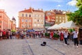 Lviv, Ukraine - June 9, 2018. Crowd watching and listening young band playing in the center of Lviv