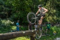 LVIV, UKRAINE - JUNE 2018: A cyclist performs tricks on a bicycle trial to overcome an obstacle course