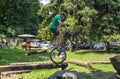 LVIV, UKRAINE - JUNE 2018: A cyclist performs tricks on a bicycle trial to overcome an obstacle course