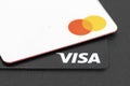 Mastercard and Visa credit cards close up. Contactless payment cards closeup. Selective focus