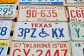 Old discontinued car license plates or vehicle registration numbers from different USA states such as Texas, Oklahoma