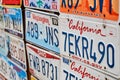 Old discontinued car license plates or vehicle registration numbers from different USA states such as California