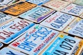 Old discontinued car license plates or vehicle registration numbers from different USA states such as California